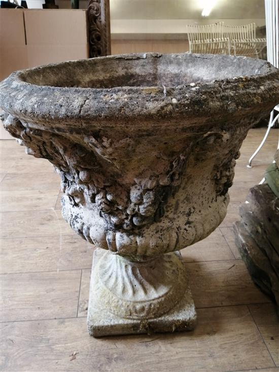 A reconstituted stone Campana garden urn on stand, H.62cm